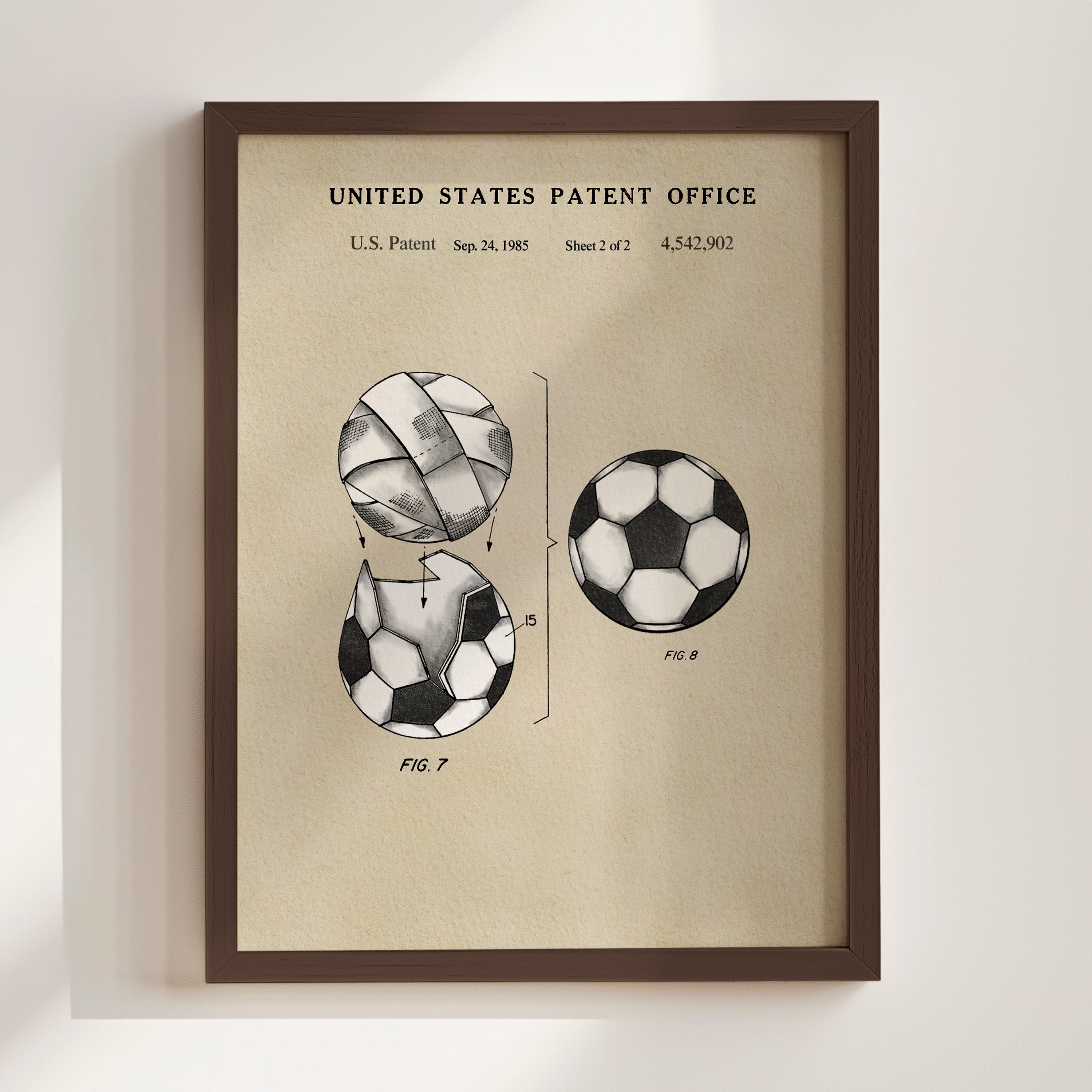 The image is a framed patent drawing depicting a soccer ball with a unique design, likely inspired by the patent filing of the same design in the United States Patent Office.
