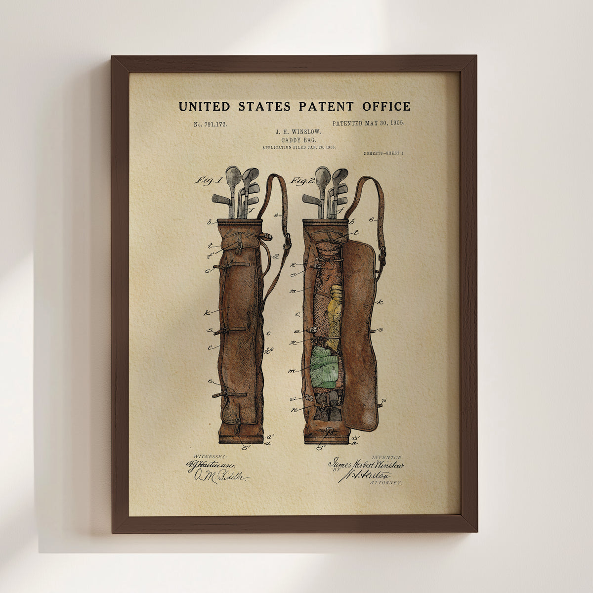 The image is a framed vintage patent drawing depicting a golf bag with a detailed illustration of its design and features.