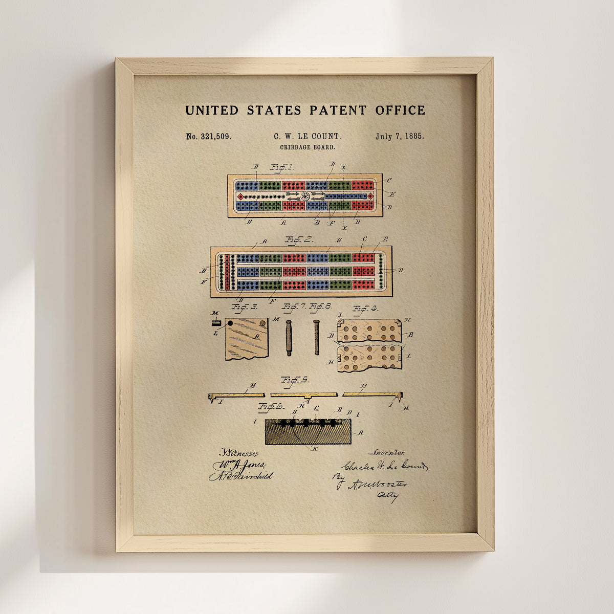 The image is a framed patent drawing depicting a device with multiple components, including a grid-like structure and various colored buttons or buttons.