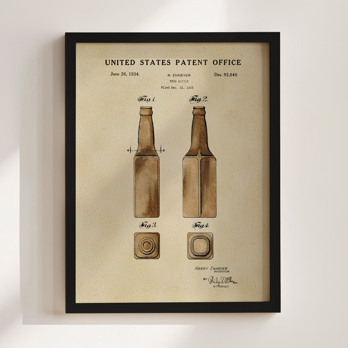 The image is a framed patent drawing depicting two bottles, with the text "United States Patent Office" and "Harvey Ennever Inventor" at the top.