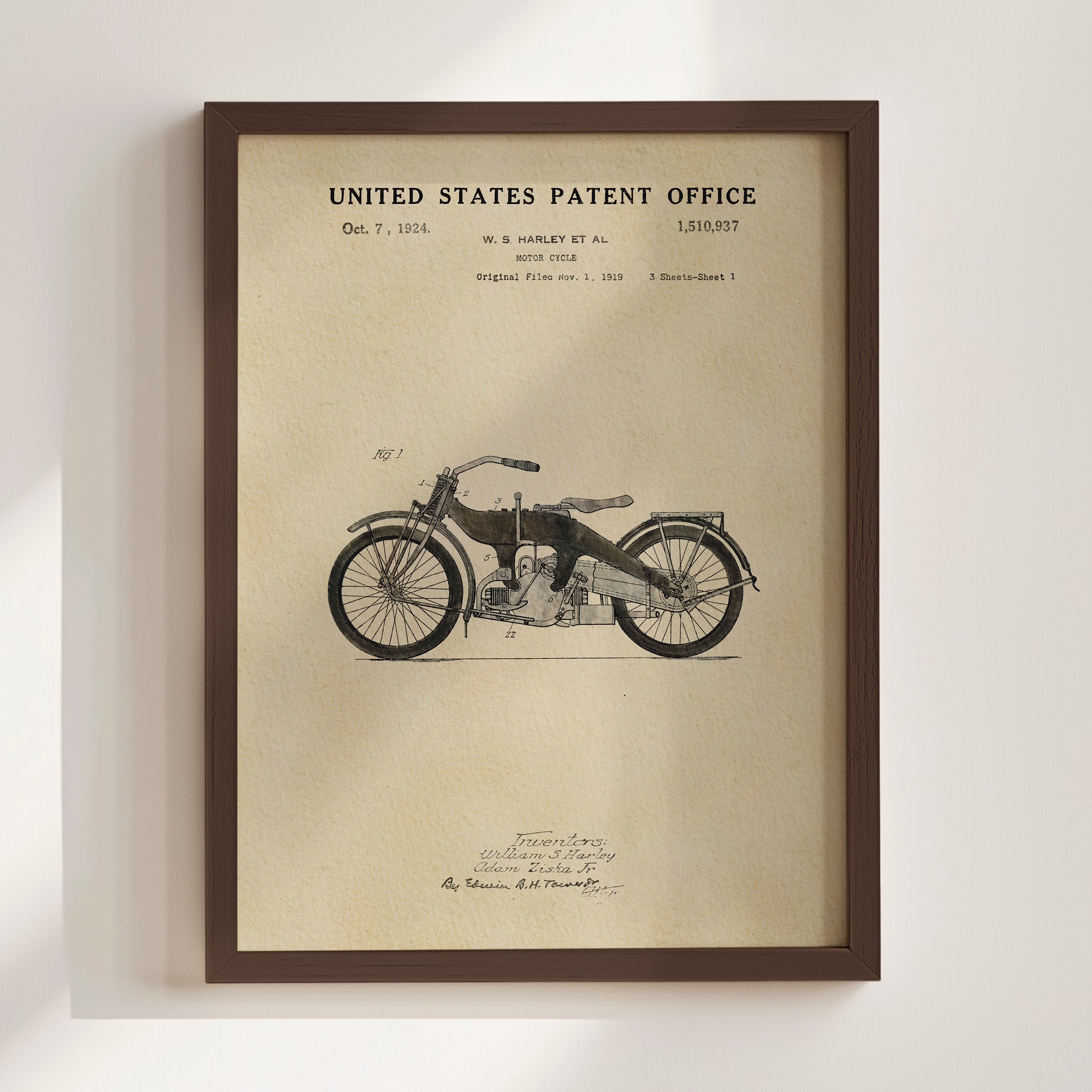 The image is a framed patent drawing of a motorcycle from the United States Patent Office, dated October 7, 1924, and created by William S. Harley.