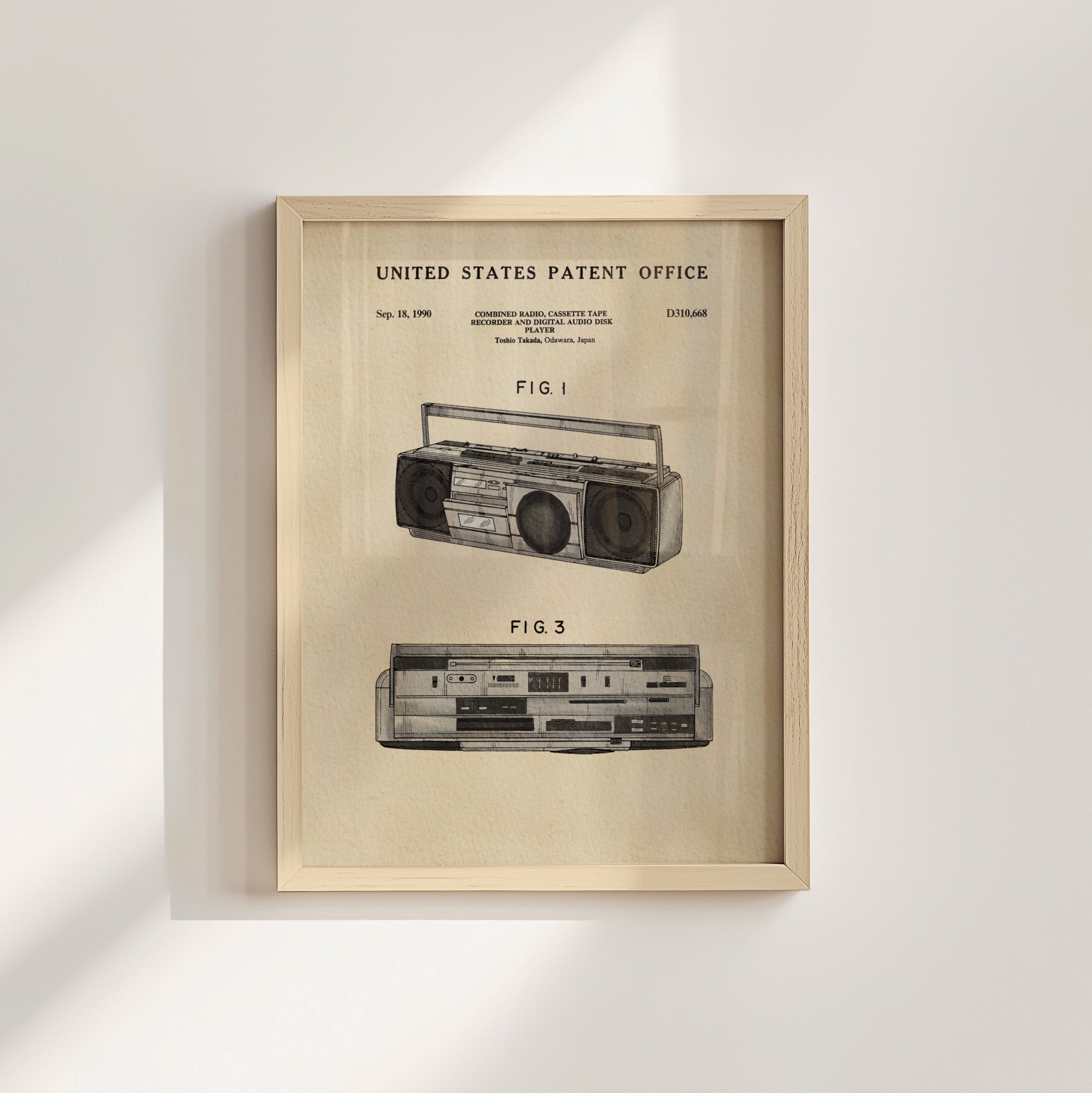 The image is a framed patent drawing of a boombox, depicting the design and features of the device.