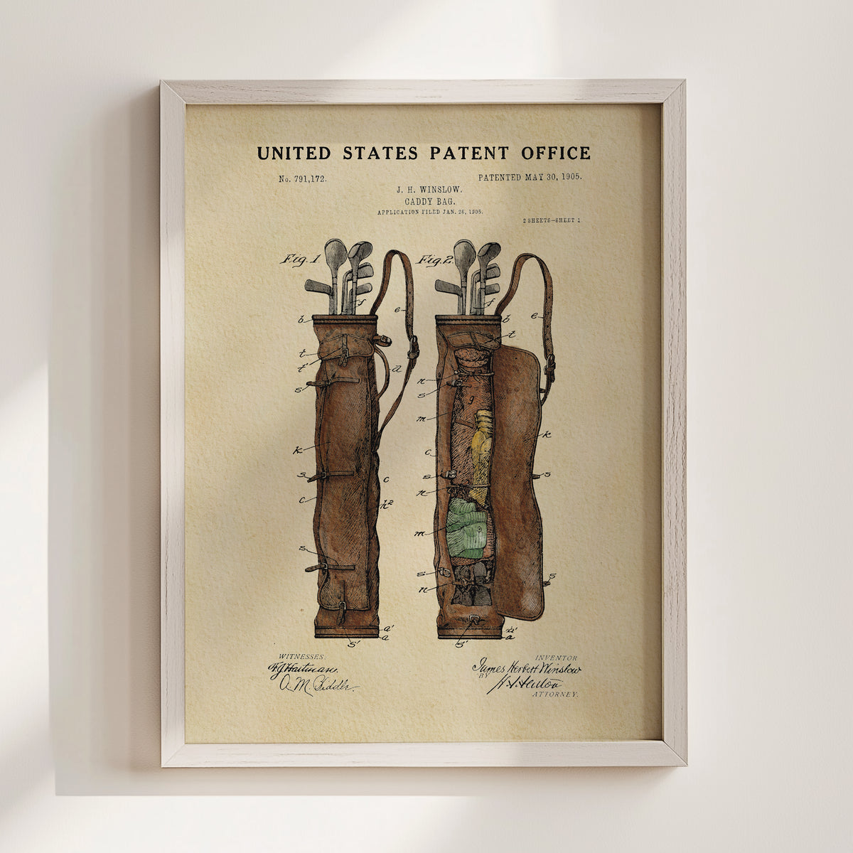 The image is a framed vintage patent drawing depicting a golf bag with a detailed illustration of its components, including the handle, straps, and compartments.